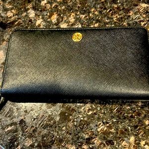 This is a Tory Burch wallet. It is black and looks brand new!
